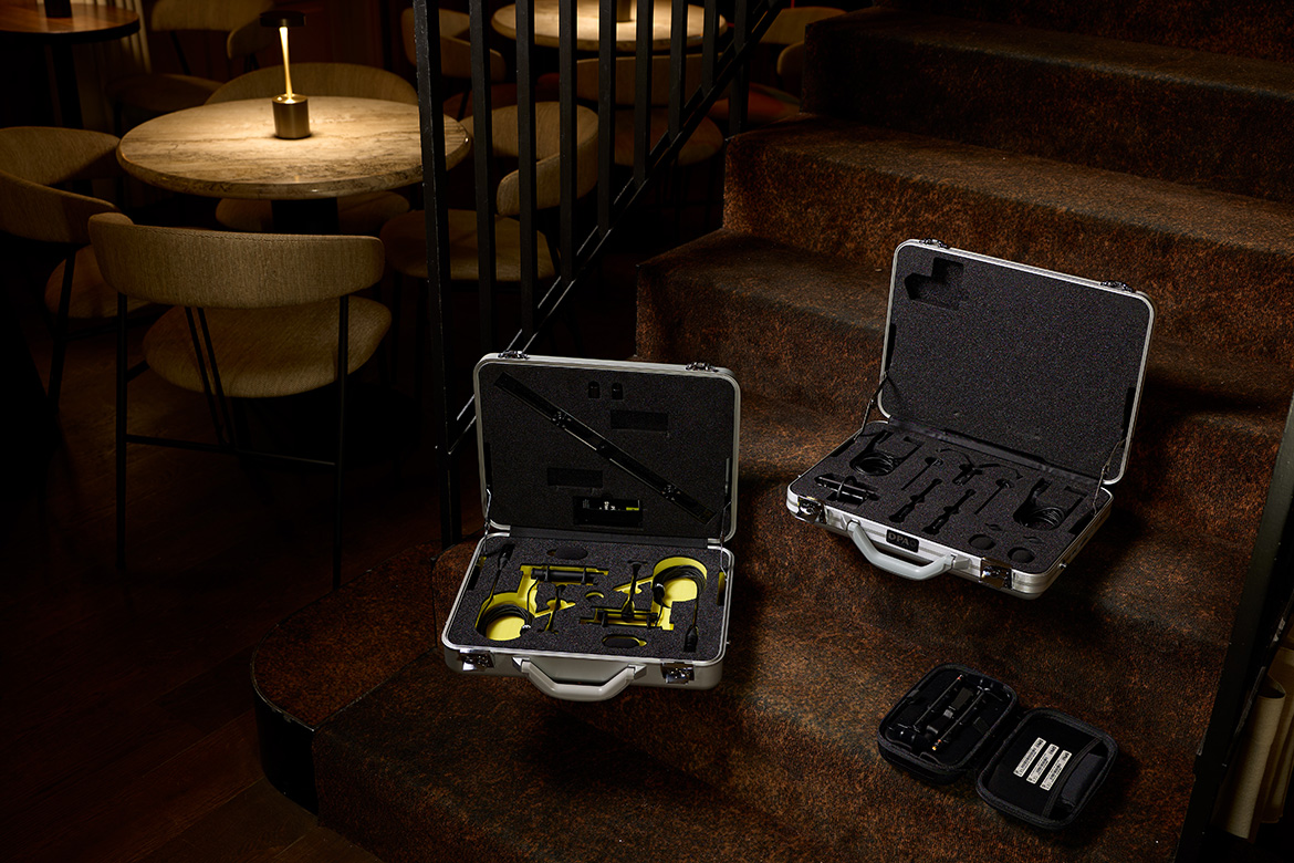 DPA piano microphone kit shown open in its case with two microphones and accessories.
